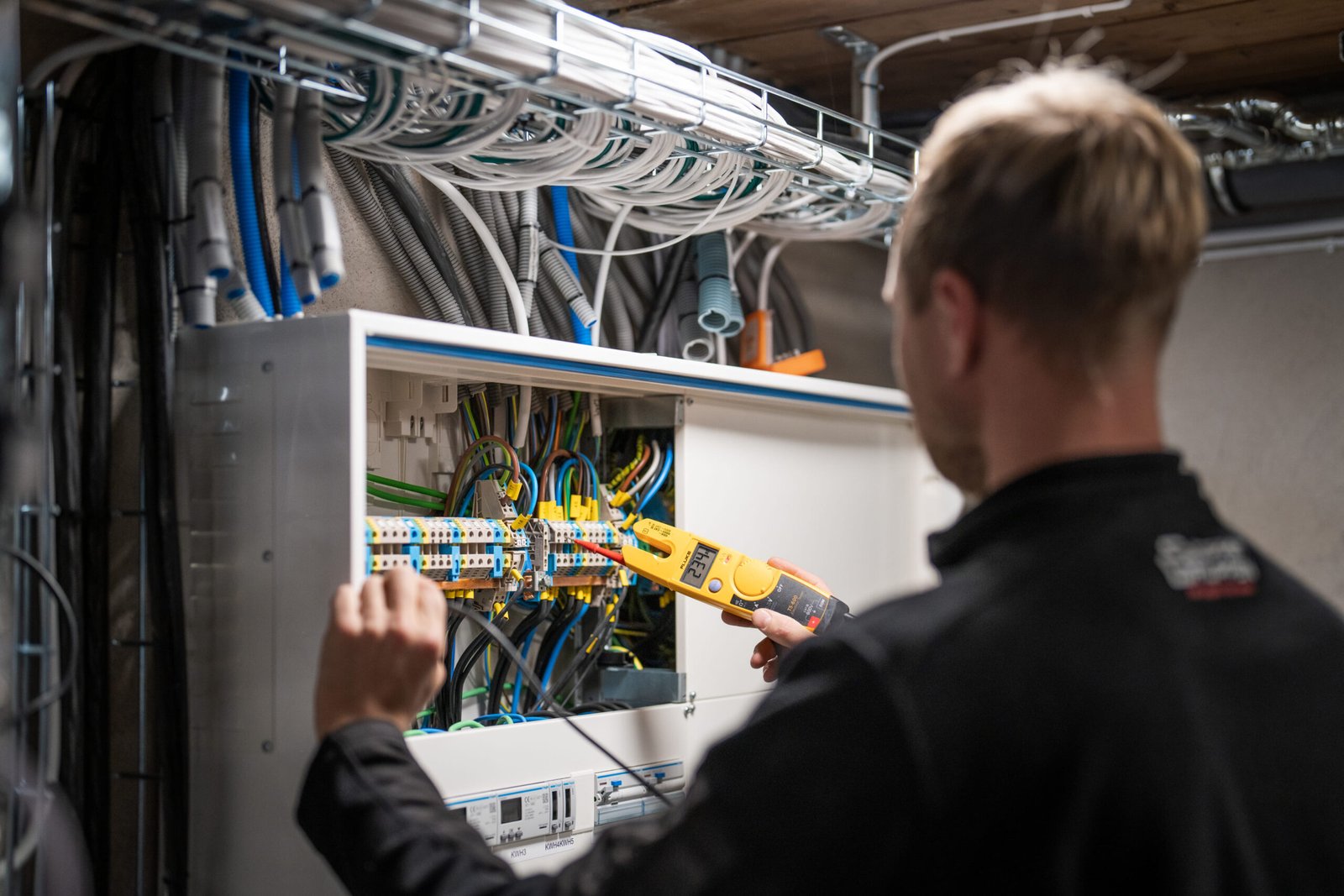 Worker operating machinery indoors – Tangen manufacturing site.