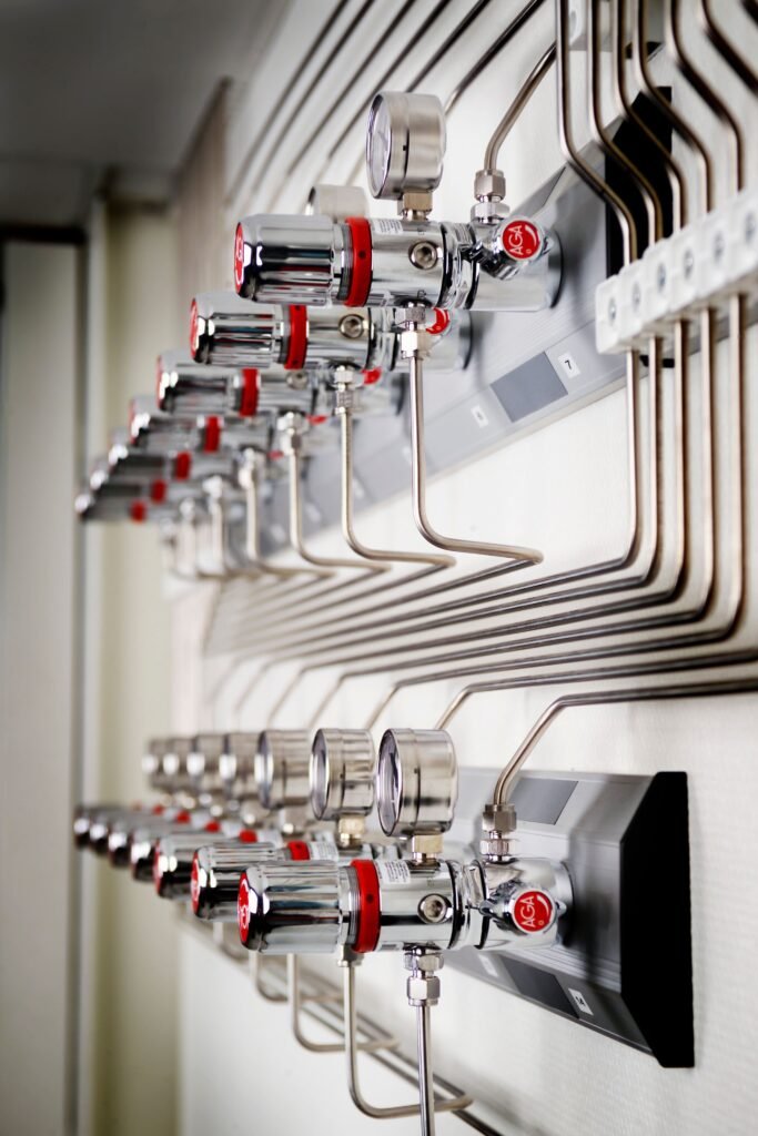 Industrial setup with multiple red-topped pipes.