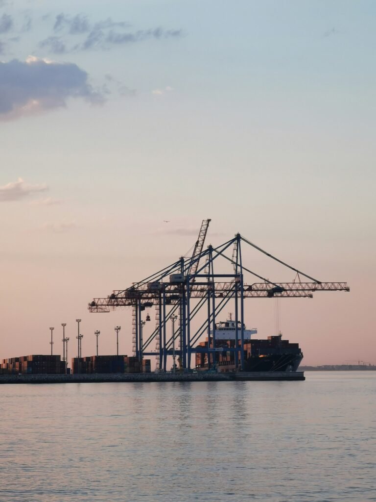 Industrial port cranes at sunset – Tangen logistics and infrastructure.